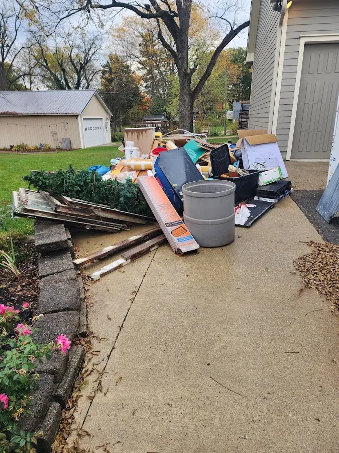 Dumpster being loaded with debris for 3 Yard Dumpster Rental in Wytheville